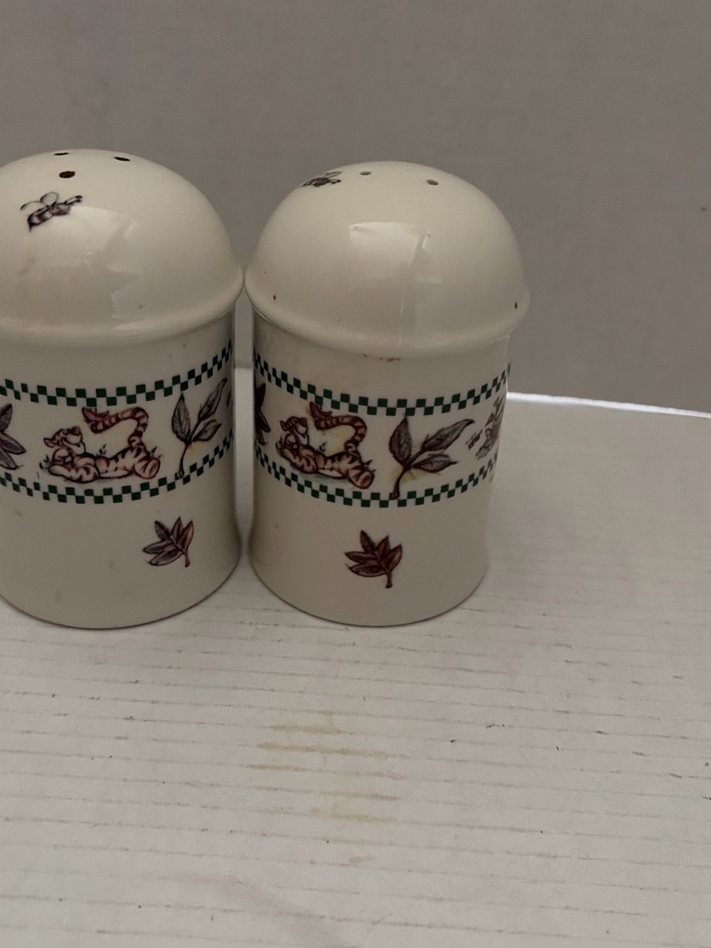 Disney Cream Ceramic Shakers with Green Check and Brown Leaf Accents